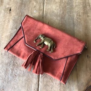 Francesca’s rust suede clutch